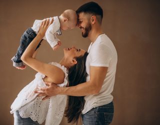 Happy family with their first child